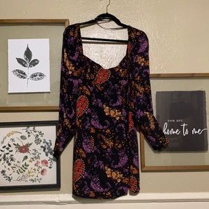 Black dress with colorful floral/paisley pattern